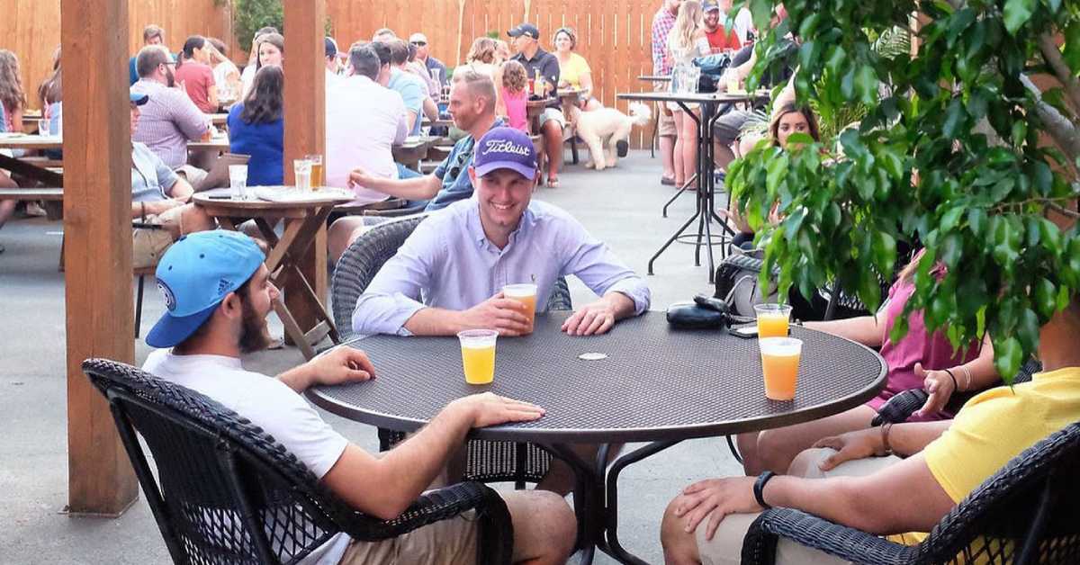 group of people at a patio table