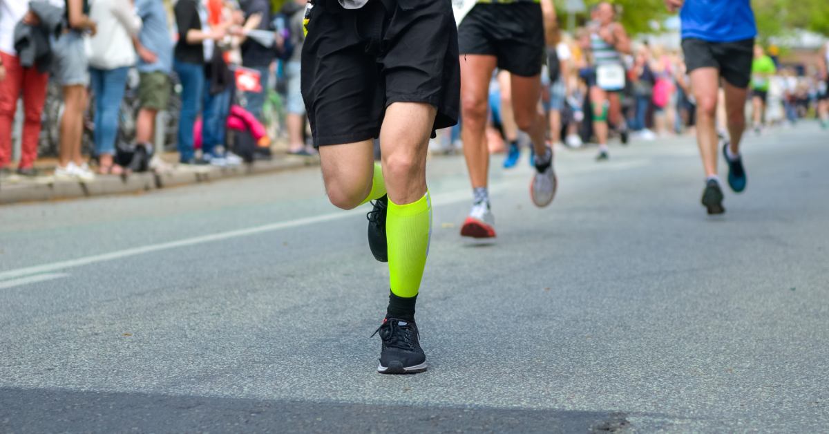 runners racing down a road