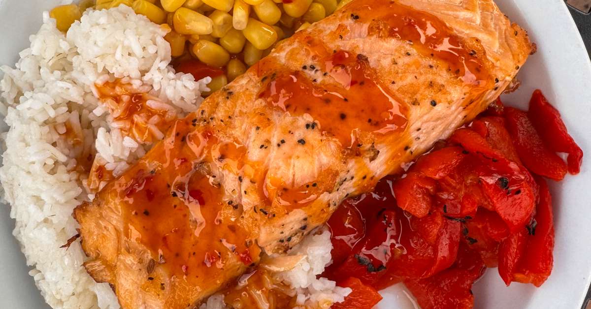 salmon bowl with cooked salmon, rice, peppers, and corn