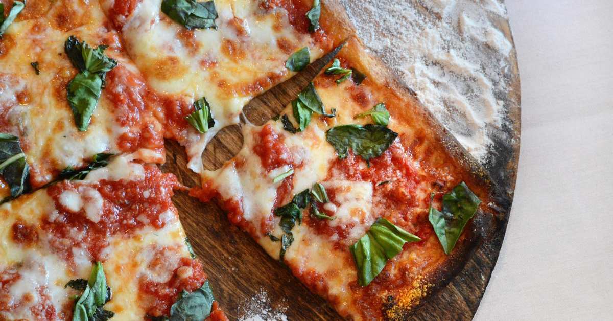 square pizza with cheese and basil