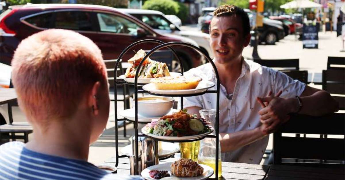two customers chatting over a tea display