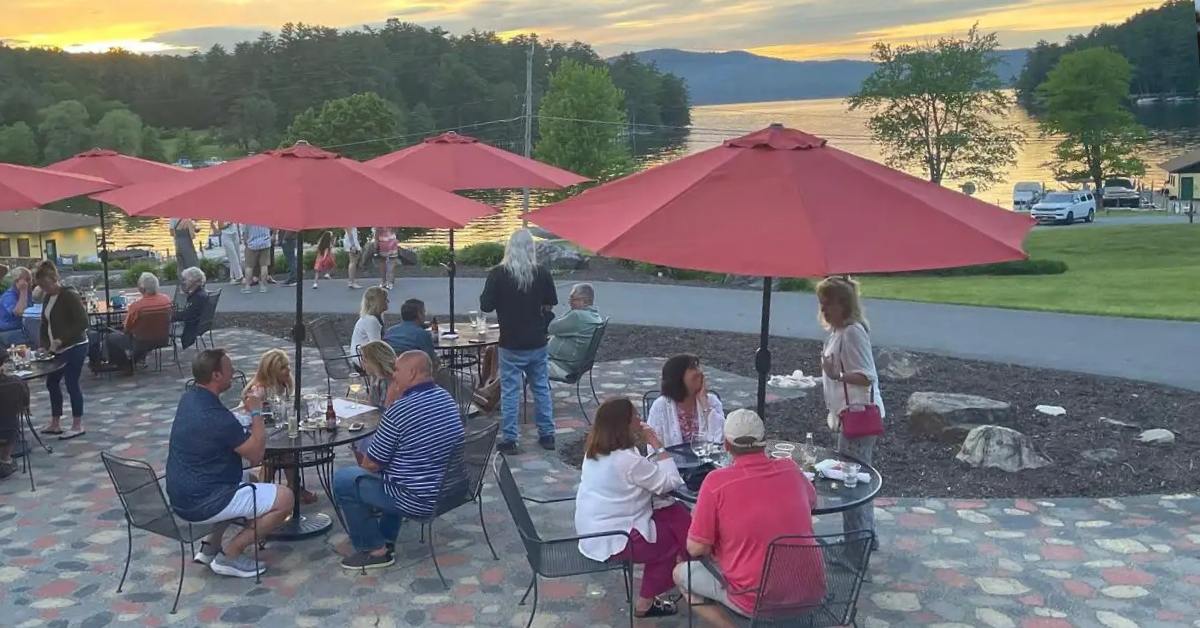 patio seating area with view of lake sunset