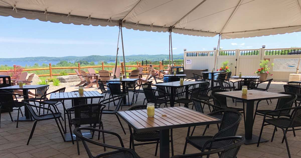 patio with tables against scenic backdrop