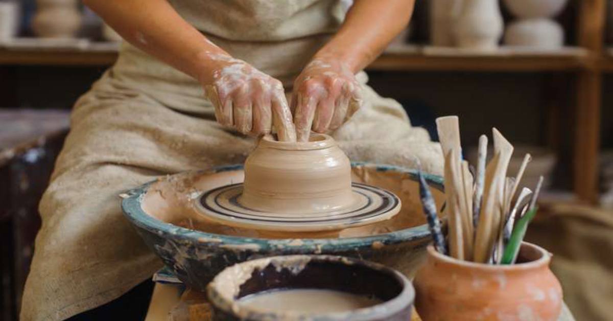 person working with clay
