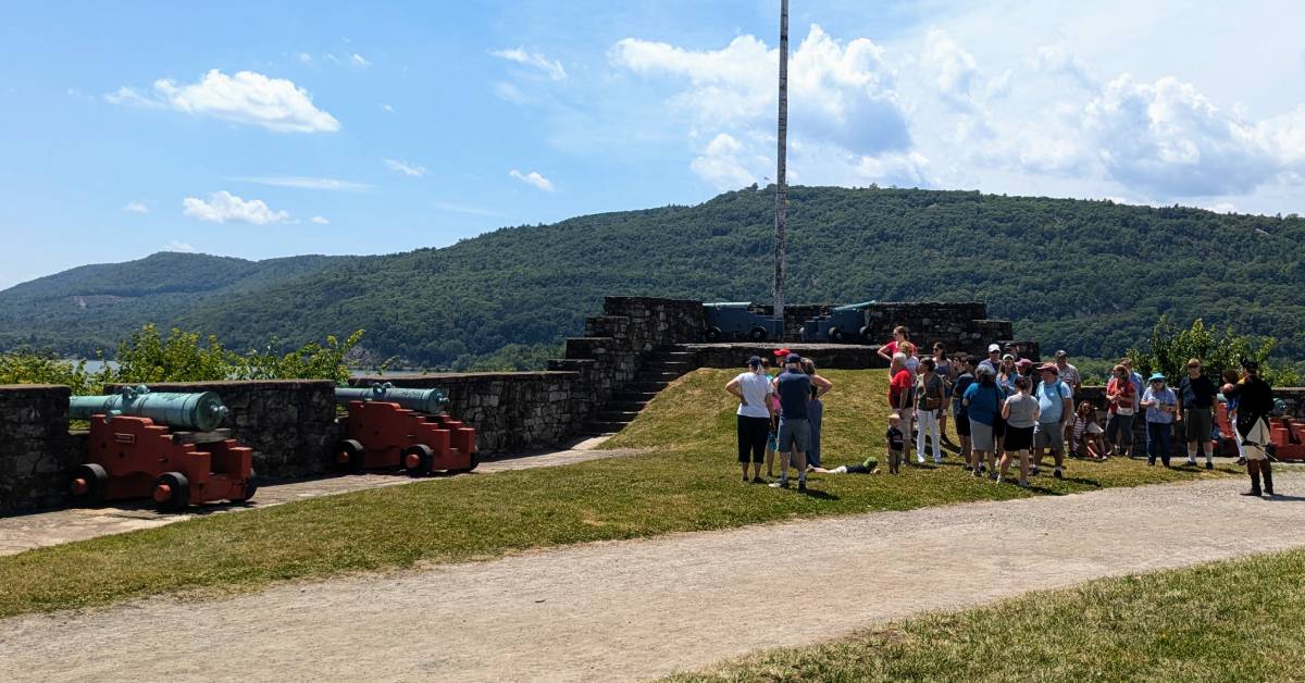 tour group at fort ticonderoga near cannons and lake champlain