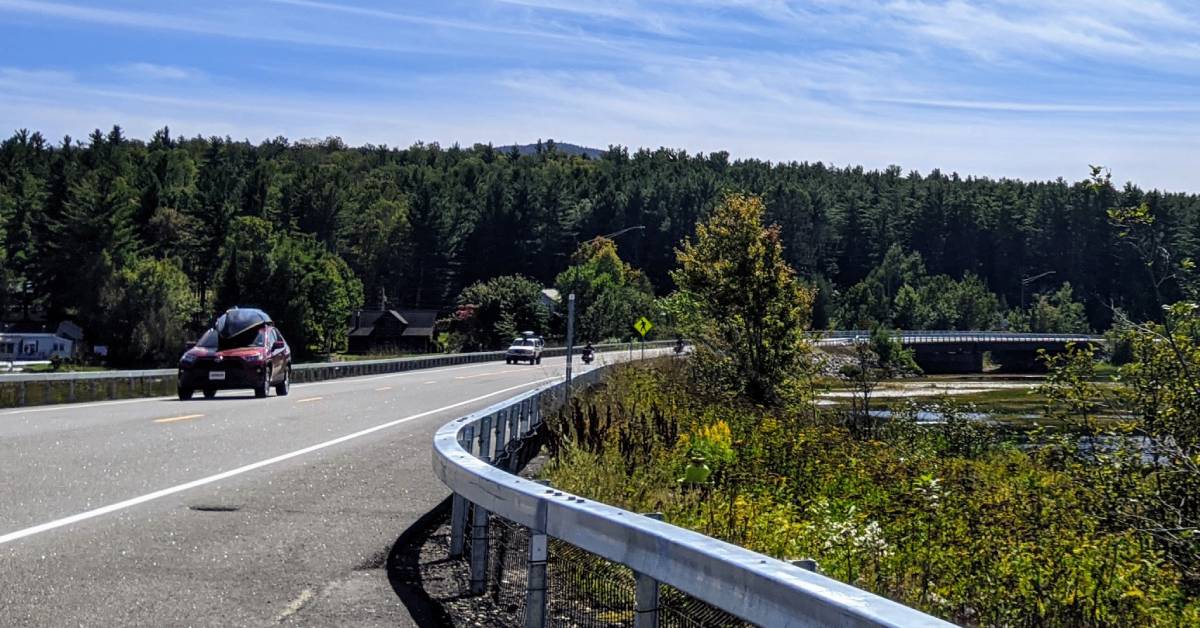 cars on road in tupper lake area