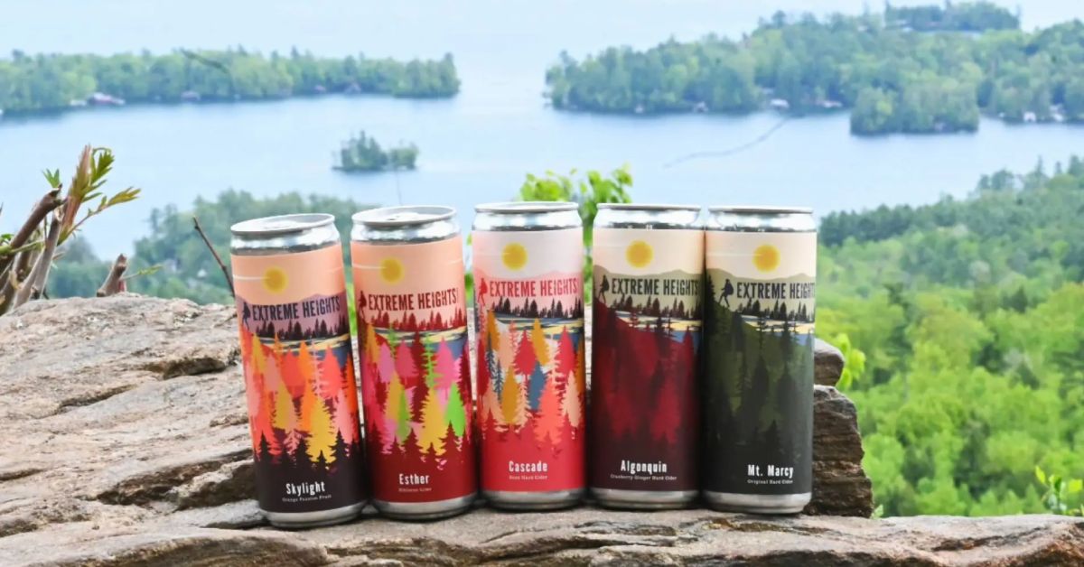 five cans of ciders with lake background