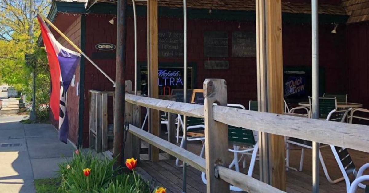 an entrance to a restaurant with a patio