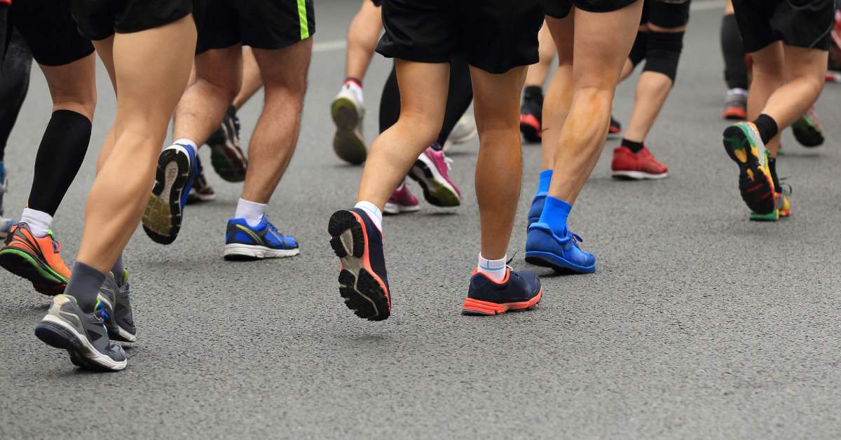 view of runners on a road