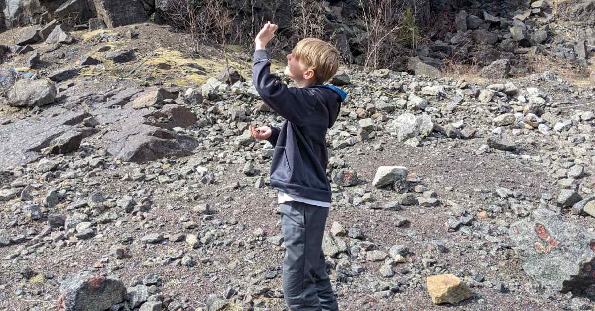 boy looking up by a mine