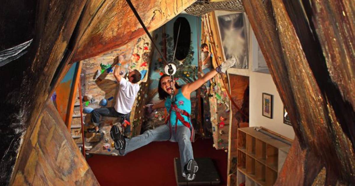 two people in a rock climbing gym