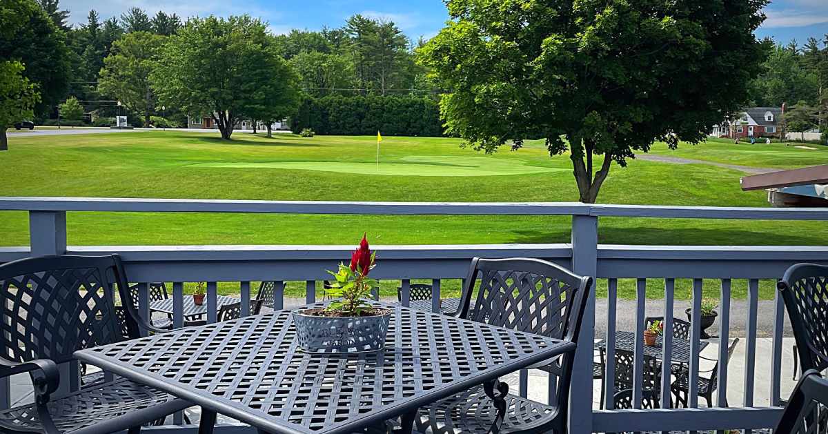 outdoor patio seating by golf course