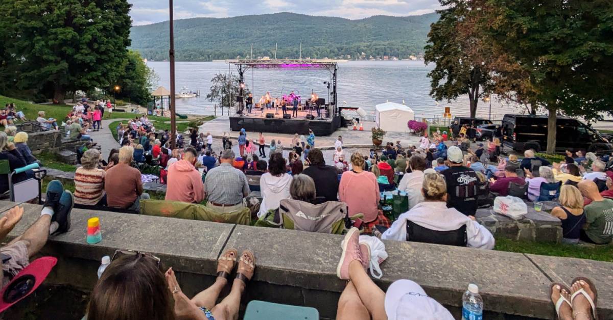 outdoor concert in evening in lake george by lake