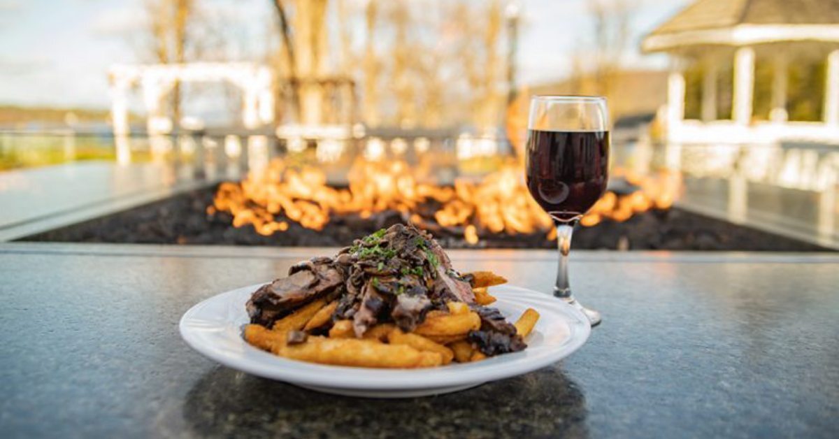 Plate of Food with a Glass of Wine by the Fireside