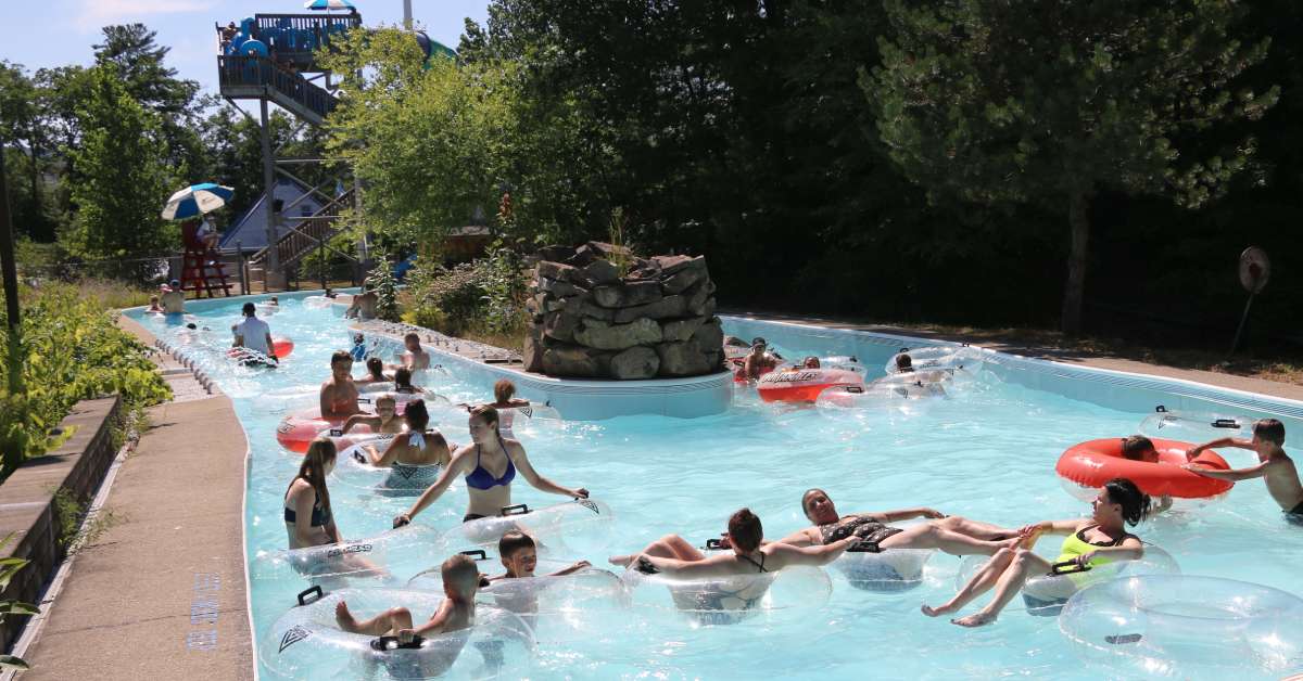 people on a floating theme park river