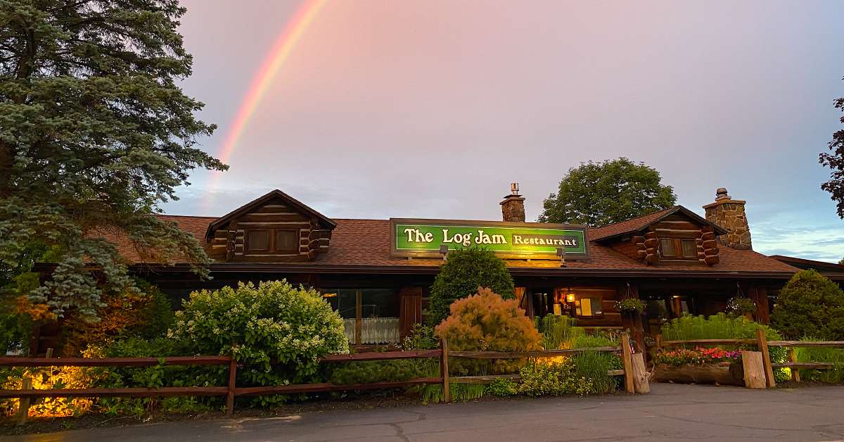 exterior of The Log Jam Restaurant with a rainbow