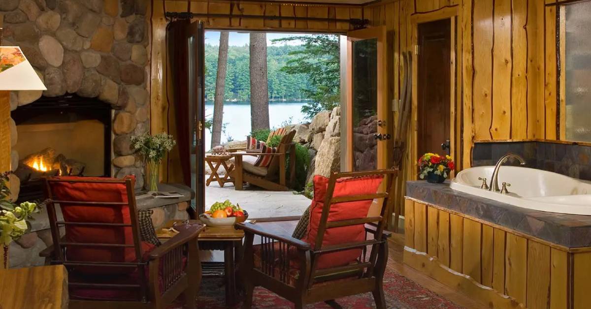 fern lodge room with hot tub and back deck with lake view
