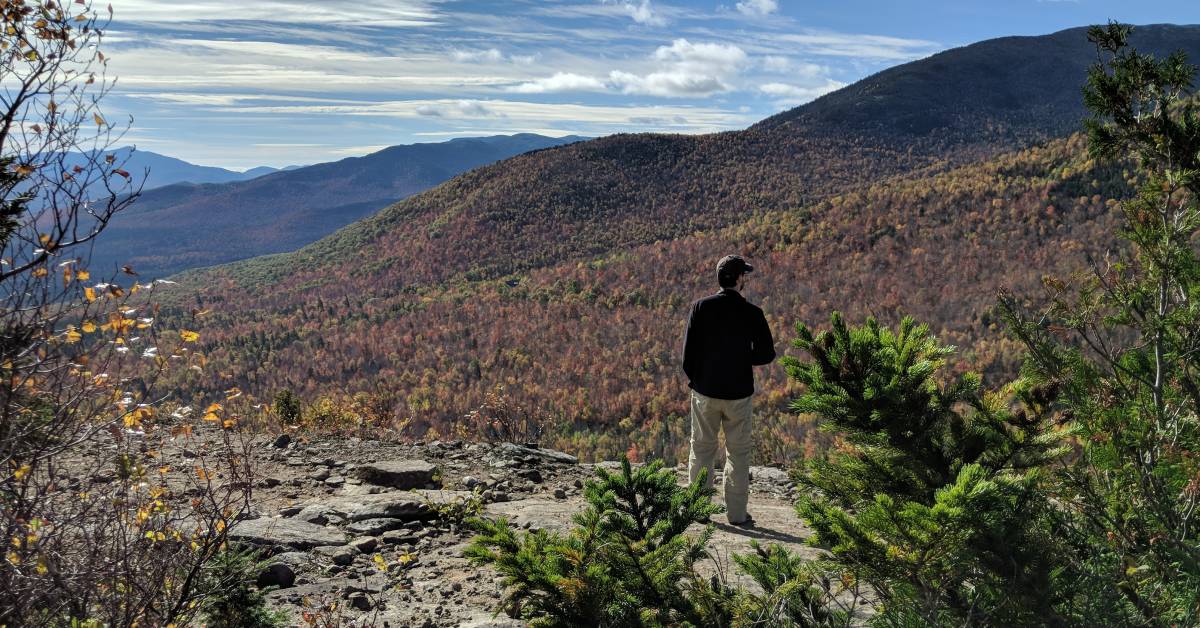 man at summit at cobble hill lookout