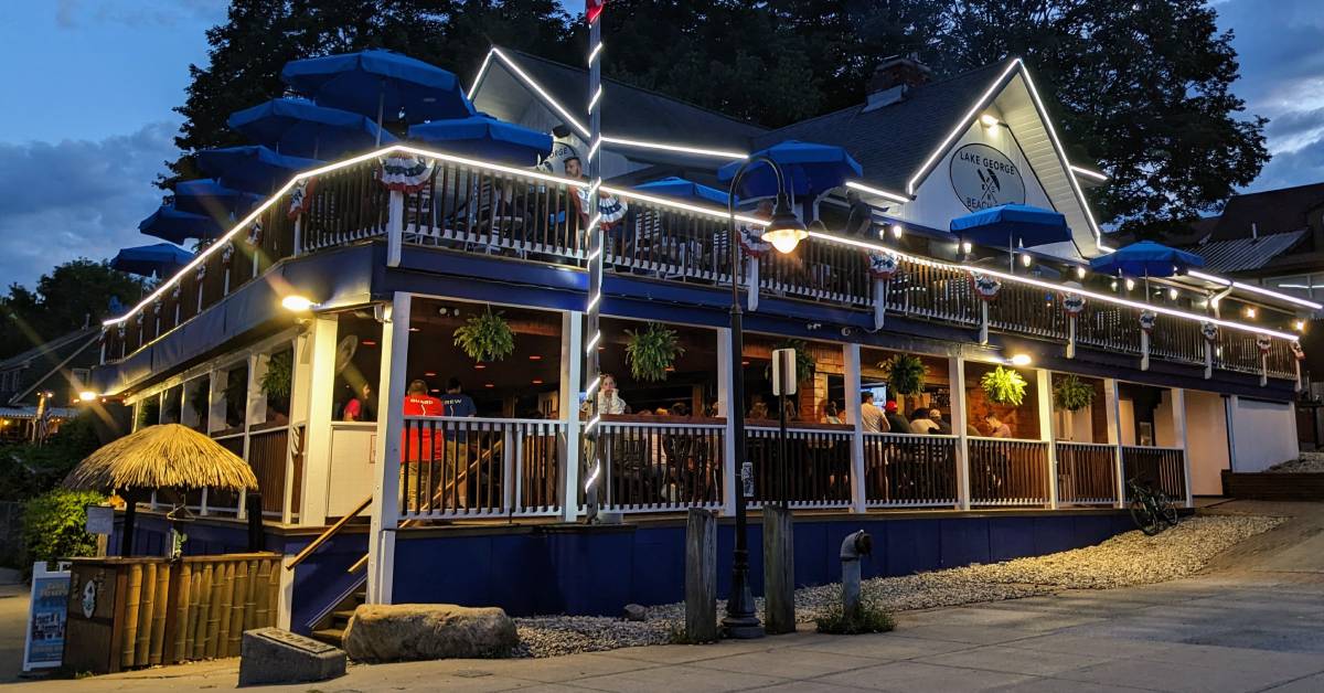 exterior of lake george beach club at night