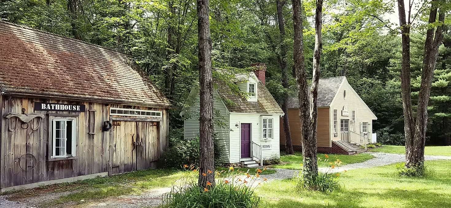 picture of three different looking cabins directly next to each other