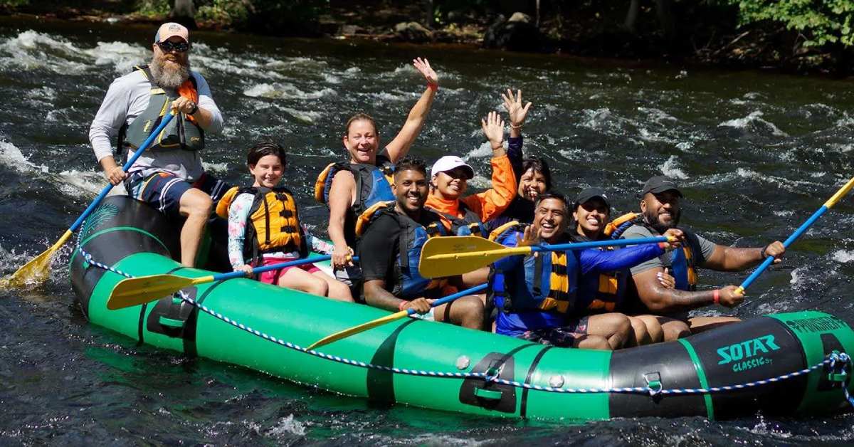 group of rafters in a green raft