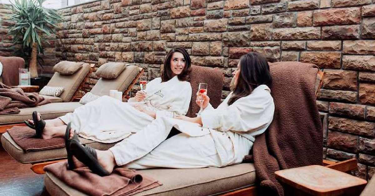 two women in robes at a spa