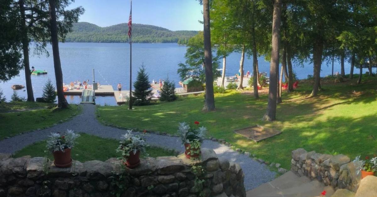 path leading down to a lake and dock