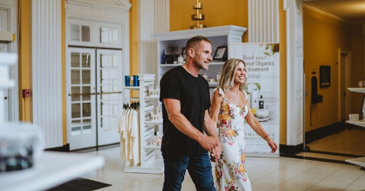 man and woman walking into a spa