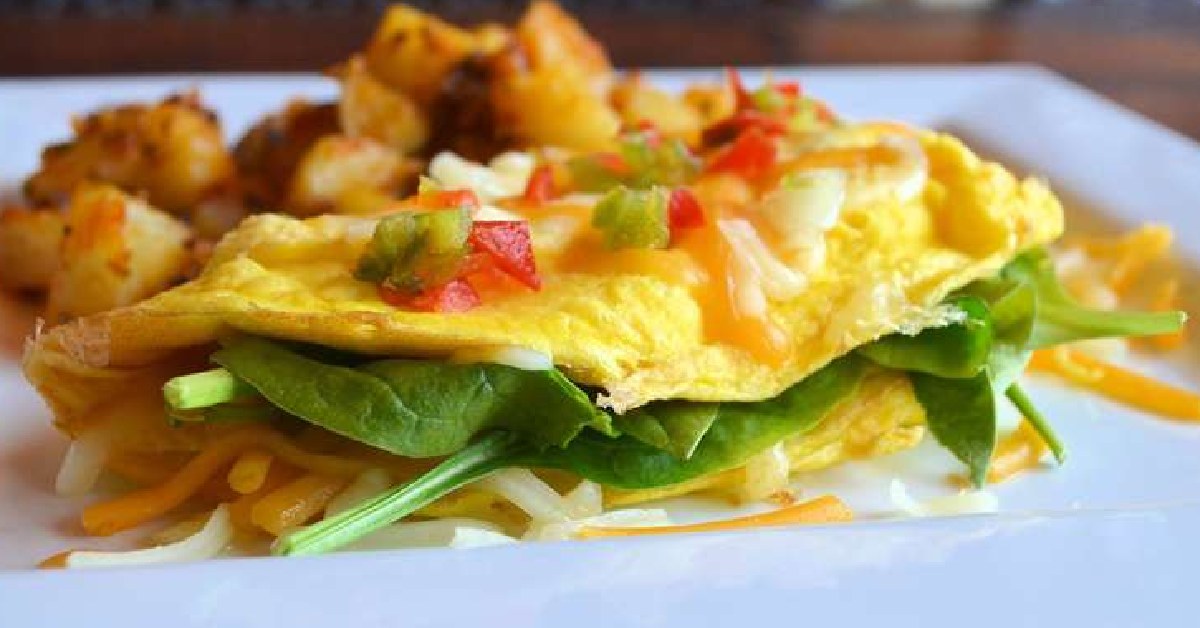 Omelette with peppers, spinach, and homefries