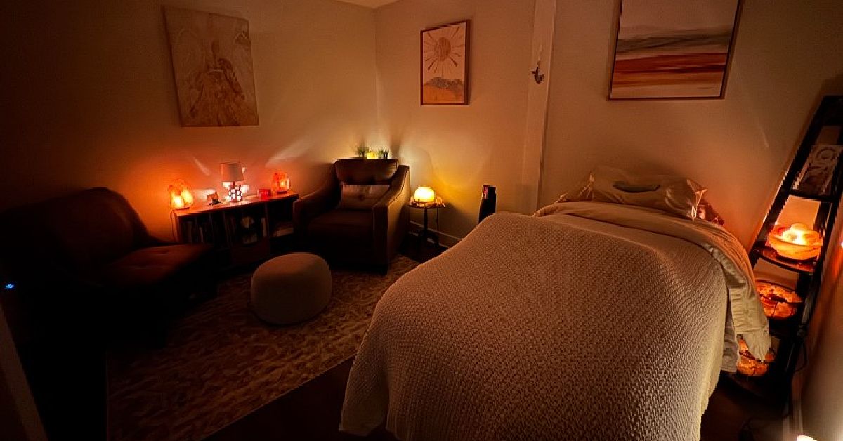 Warm lighting with bed at Saratoga Reiki Room