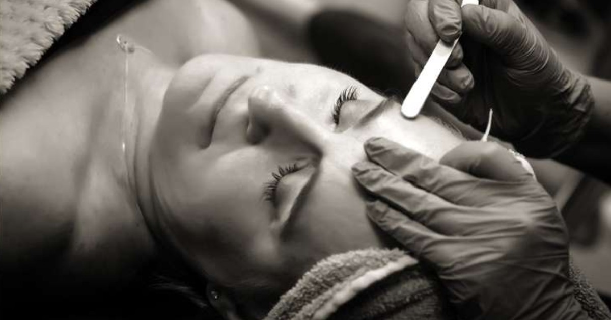 black and white photo of eyebrow waxing