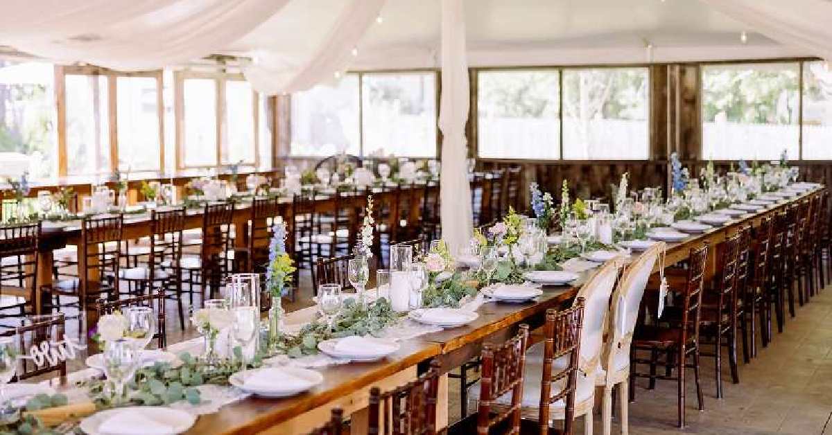 wedding tent with tables and tableware