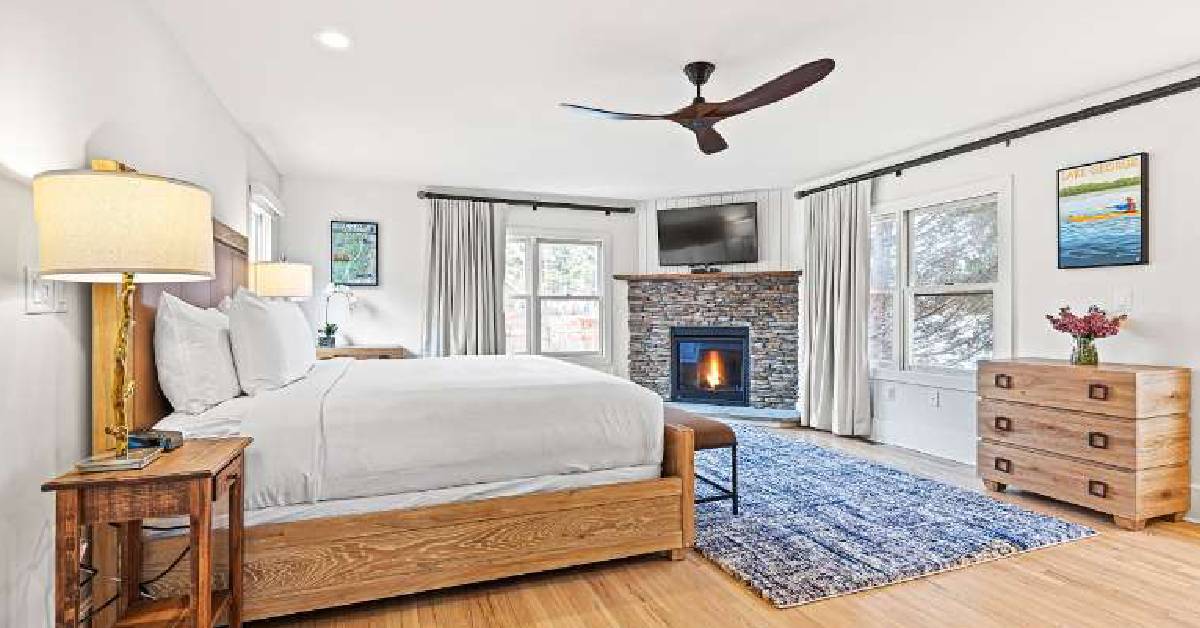 resort bedroom with bed and fireplace