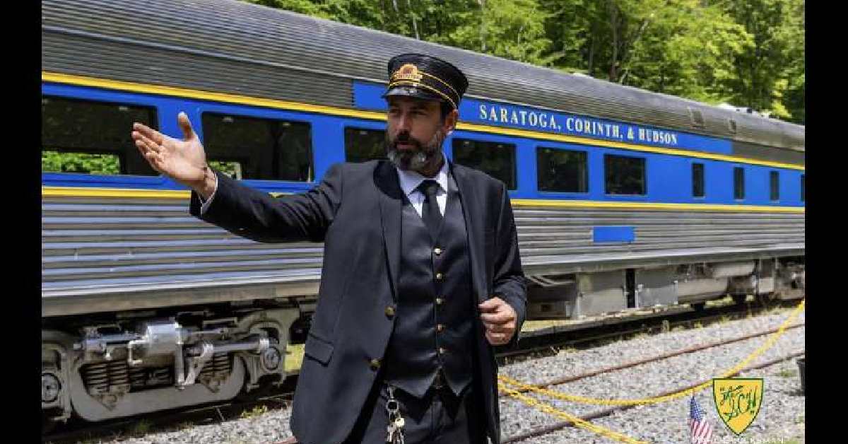 Conductor next to the train