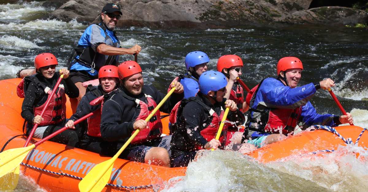 group of rafters in an orange raft