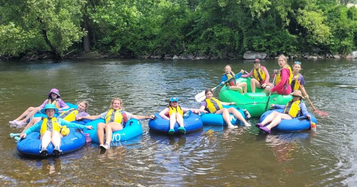 people with tubes on a river