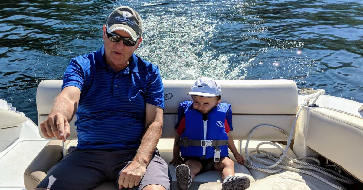 grandfather and toddler on boat