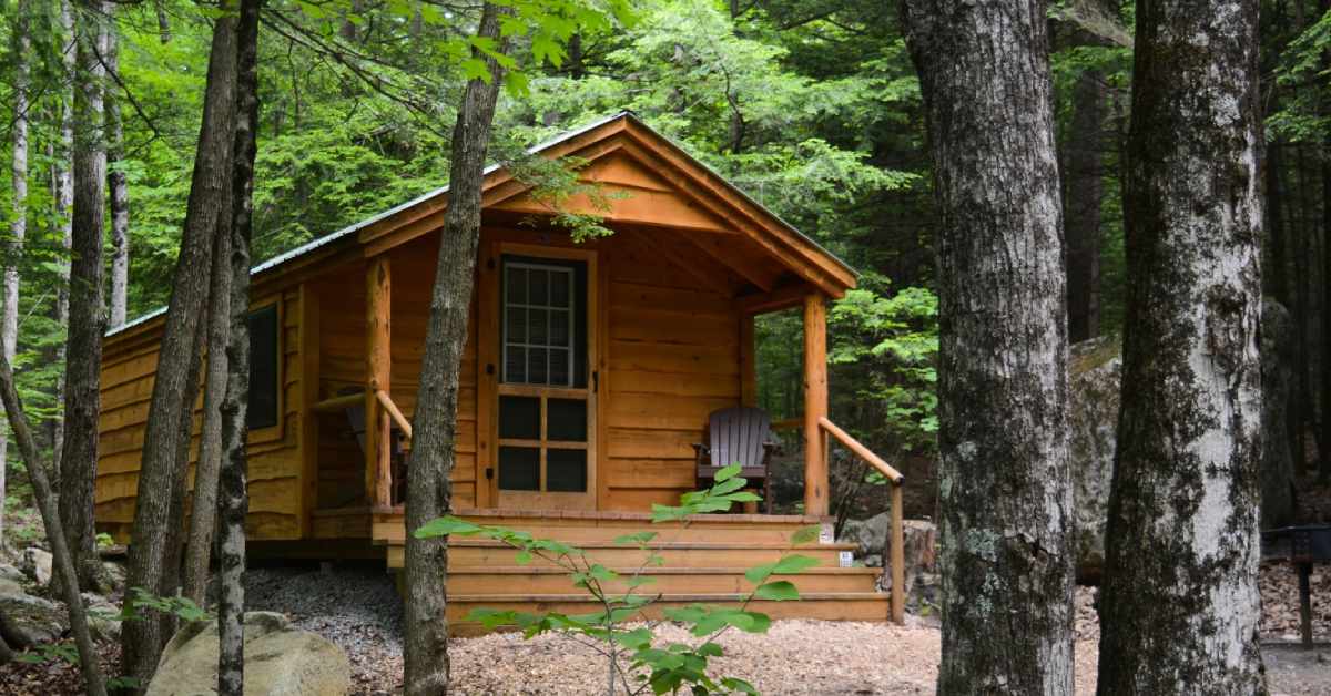 exterior of a rustic cabin in the woods