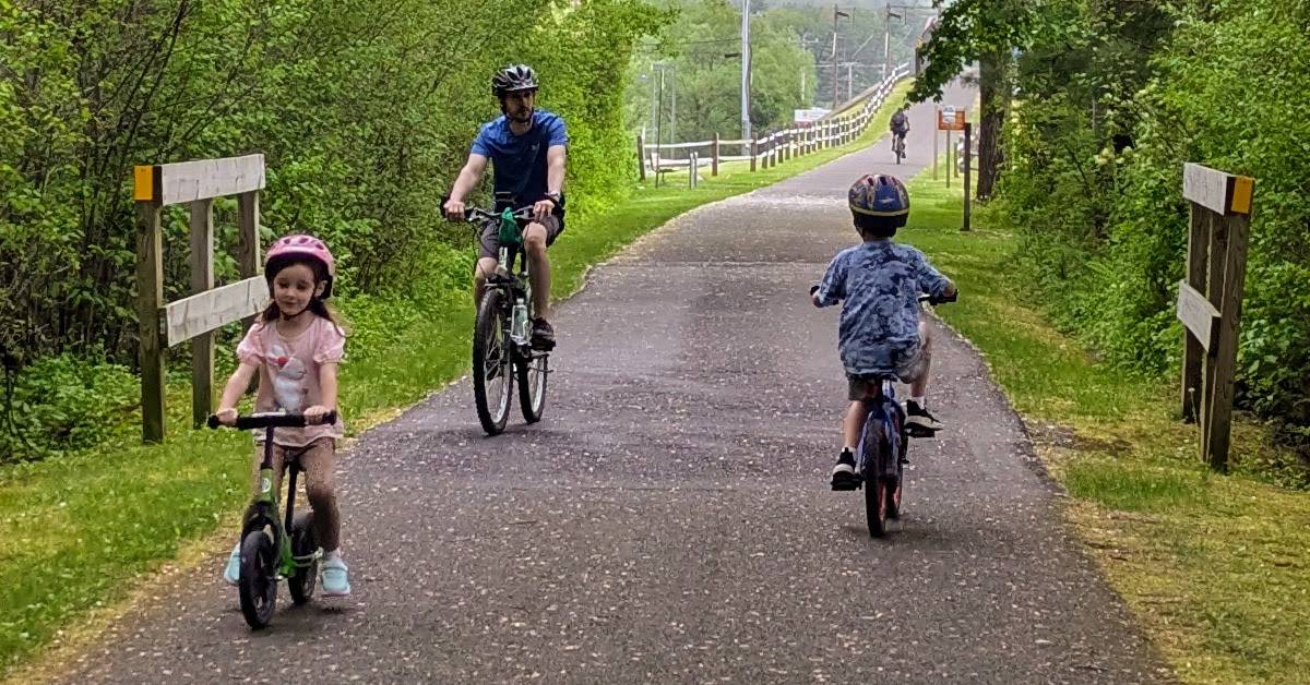 dad with kids on warren county bikeway