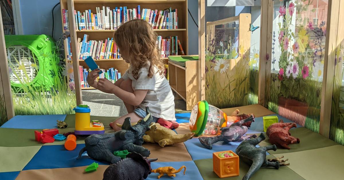 little girl in play area at crandall public library