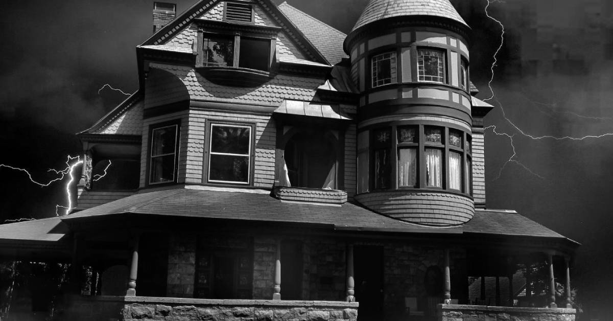 black and white image of inn with lightening striking