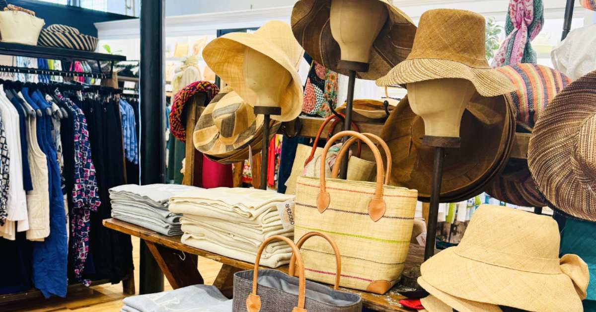 bags, hats, and shirts in a women's clothing store