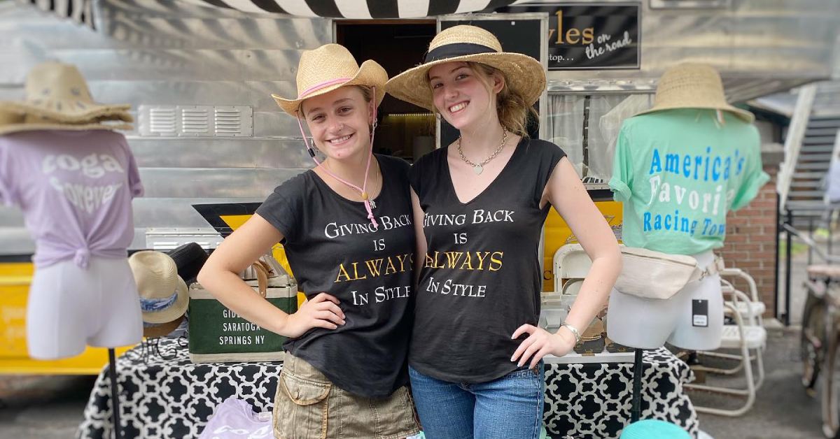 two women in front of camper shop