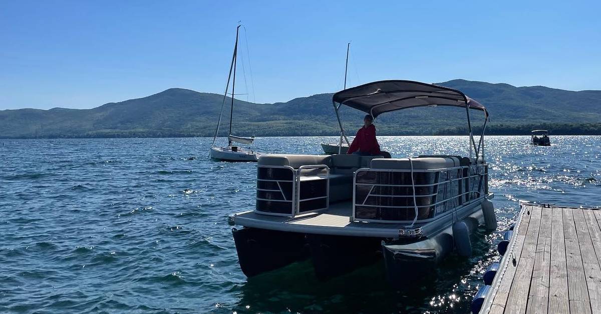 boat leaving dock on lake george
