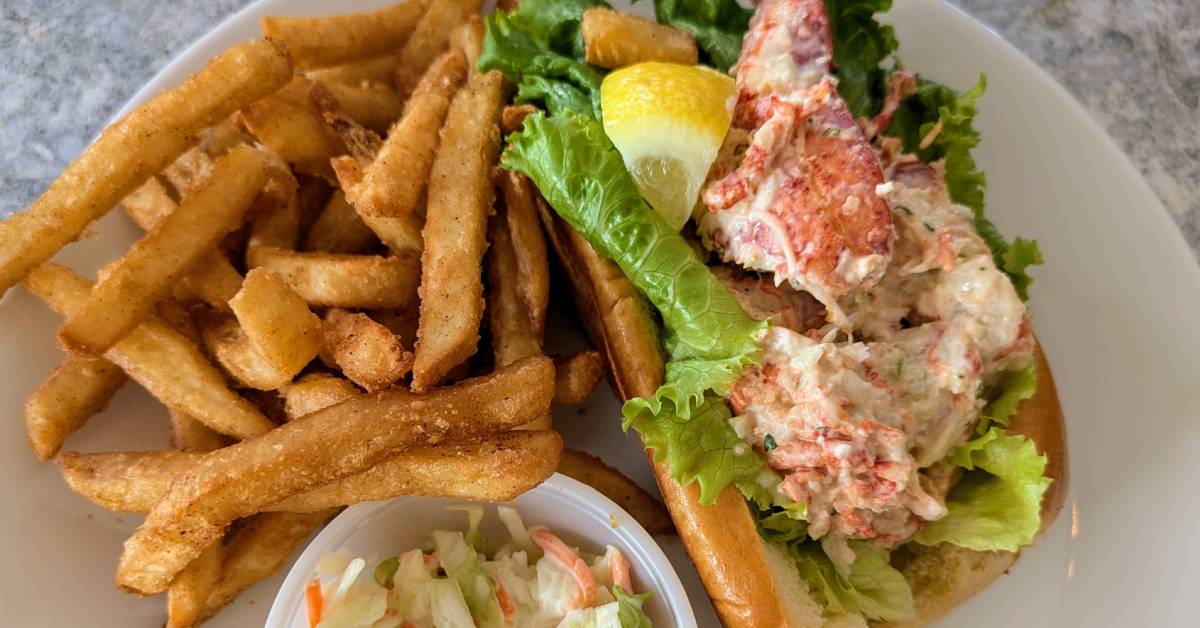 lobster roll with beer battered fries and colesaw