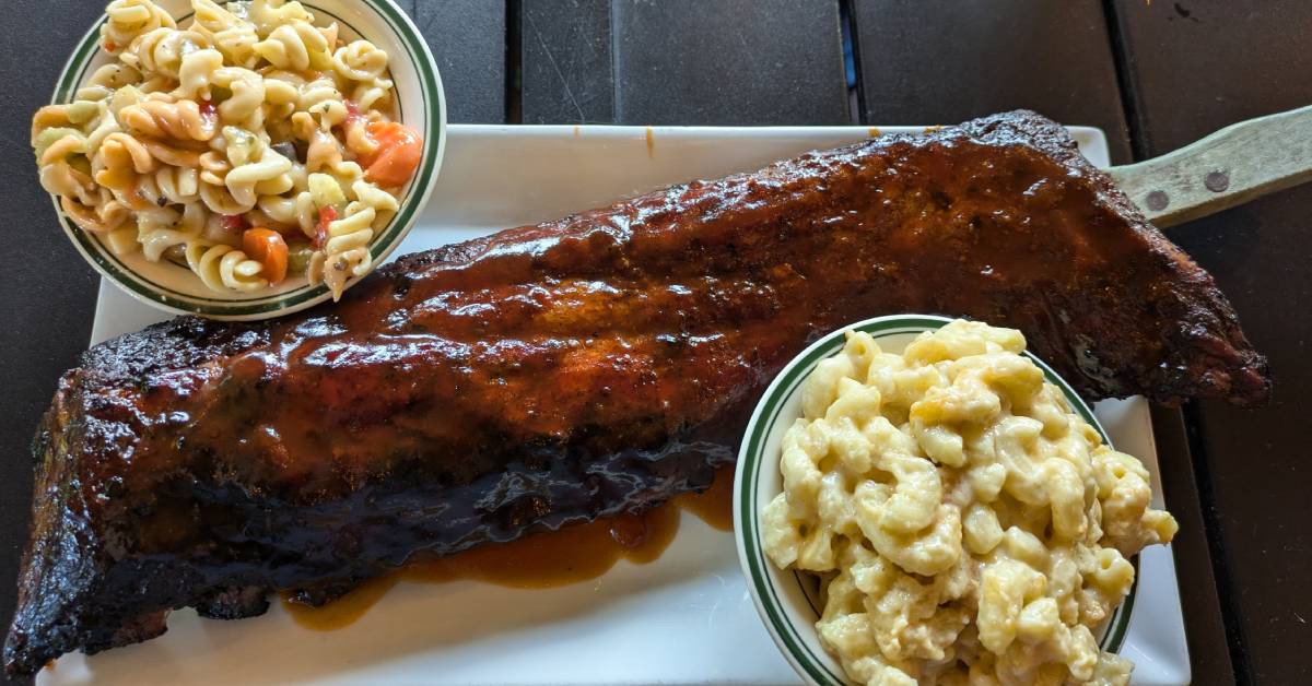 brisket with pasta salad and mac and cheese