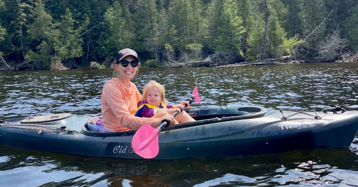 woman in kayak with girl
