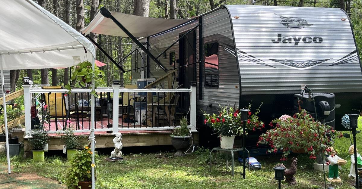 rv campsite with porch and plants