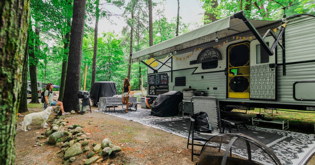 rv campsite with people and dog