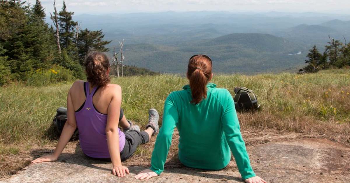 two women checking out mountain view